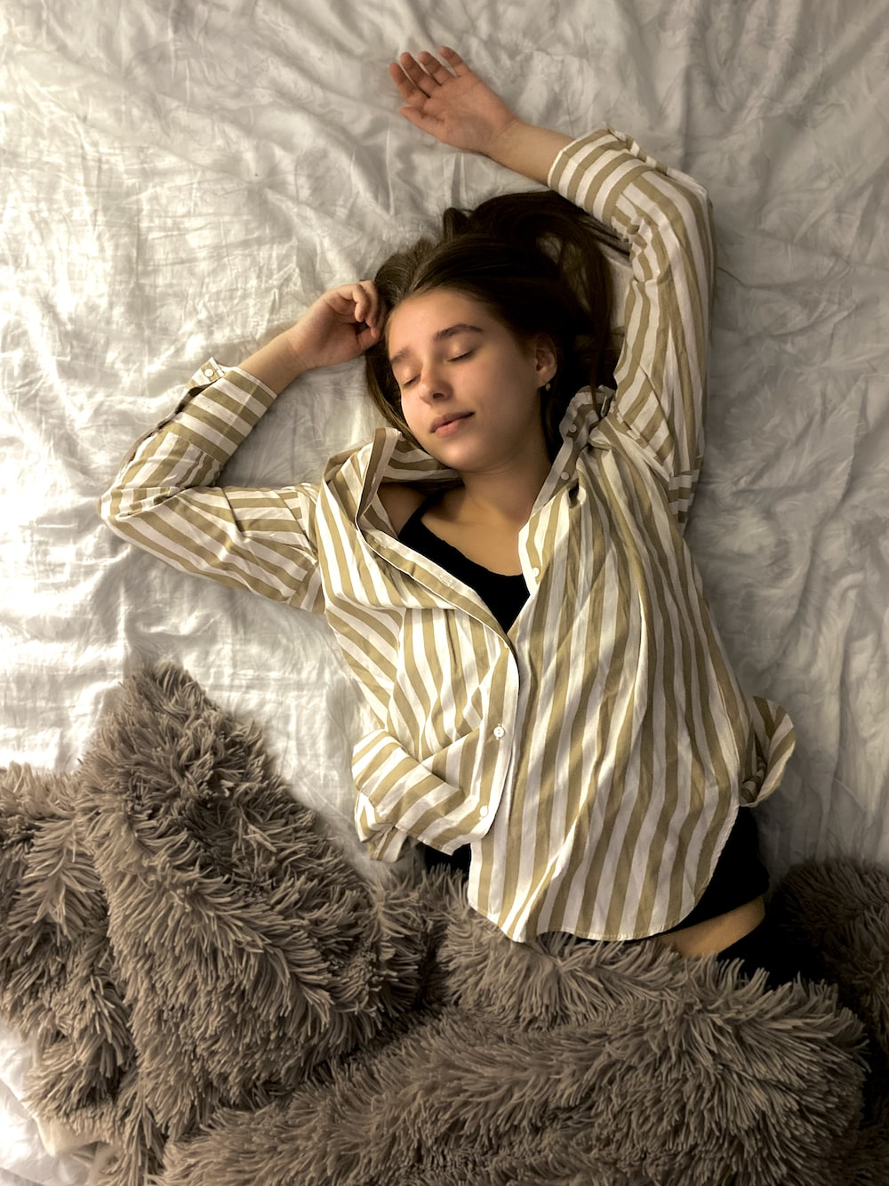 a girl sleeping in bed.