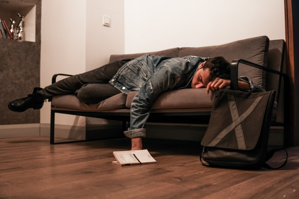 A man lying on a couch