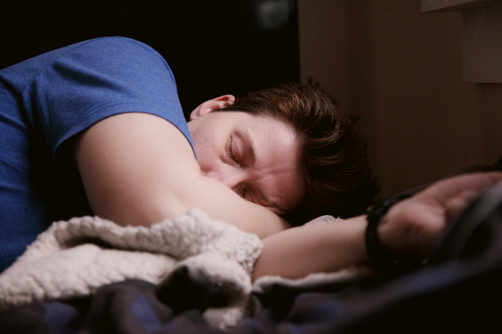 A man sleeping in bed.