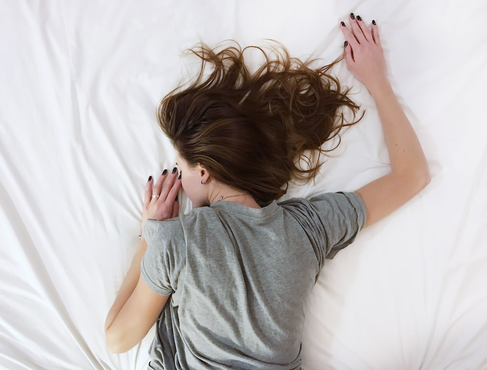 A woman sleeping in bed.